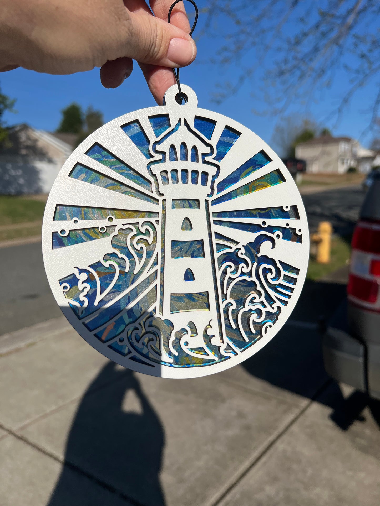 Lighthouse blue yellow sky swirl